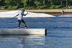 Rider performing a wakeboarding trick on a cable park at Stawiki pond in Sosnowiec.