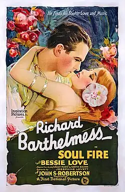 Vintage illustrated film poster showing a man and woman embracing amid pink flowers