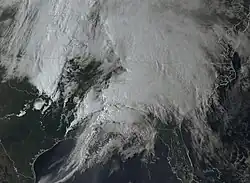A satellite image showing a storm hovering over the Southeastern United States