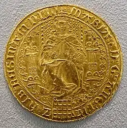 Gold coin showing a woman seated on a throne