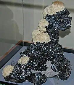 Faceted blendes, from Spain, Max Rouger collection. Sphalerite and barite from Cumberland Mine, Tennessee, US