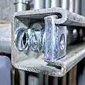 Spring-loaded nut placed inside the channel allows connections with bolts.