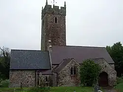 A church with a tall church tower positioned centrally.