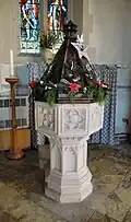 The baptismal font dates to about 1450