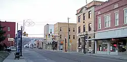 2nd Street in the central business district of St. Marys in 2006, with train tracks along the street