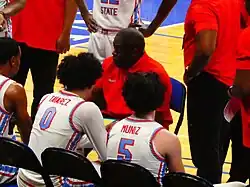 Image of Stan Waterman speaking to players while coaching at Delaware State University