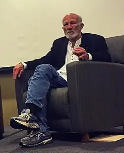 Hauerwas sitting in a chair