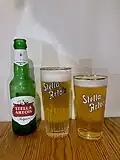 Belgian pilsner Stella Artois: the ribbed 'Ribbelglas' (center) and the 'Boerke' variety (left).