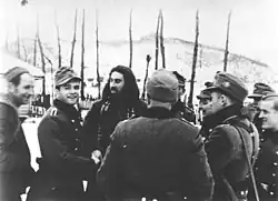 Chetnik leader Stevan Damjanović conversing with German mountain troops during the operations