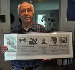 Steve Poleskie holding a poster reading "Art Washington 1987"