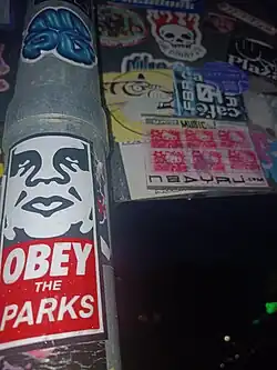An OBEY Giant sticker created by Shepard Fairey in 1996,[10][35] based on the original Andre the giant has a posse sticker first created by Fairey in 1989.[8] This image has become famous across the world for its ability to parody "Orwellian"[11] propaganda.[13] Darlinghurst, Sydney, 2025.