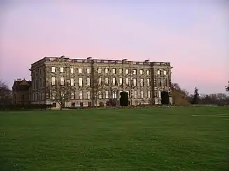 A four-storey baroque wing with fifteen bays build with silver-coloured stone