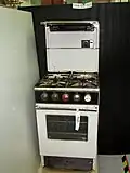 Stove with integrated backsplash
