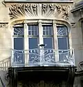 Wrought iron balcony and detail of the façade