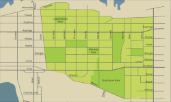 A map of the neighbourhood, highlighted light green, with streets and parks indicated