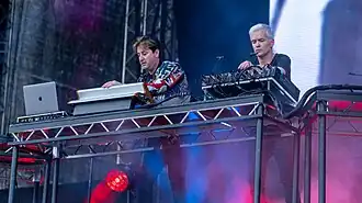 Tony Di Blasi (left) and Robbie Chater (right) performing as The Avalanches in 2022
