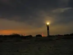 Charleston Light viewed from the beach at dusk