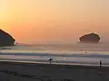 Carvannel Downs Beach near Portreath, Cornwall, England. The beach and Gull Rock at sunset