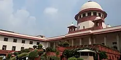 The Supreme Court of India was designed by Ganesh Bhikaji Deoalikar and completed in 1958. Its style was inspired by the Lutyens-Baker buildings.