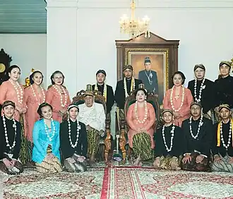 Susuhunan Pakubuwono XIII with GKR. Pakubuwana and their children (standing from left to right) GRAy. Putri, GRAy. Devi, GKR. Timoer, KGPAA. Hamangkunegoro (who would later become Susuhunan Pakubuwono XIV), KGPH. Mangkubumi, and GRAy. Ratih, as well as sons-in-law and grandchildren, after the Kirab Pusaka 1 Sura ceremony at Surakarta Palace, February 8, 2024.
