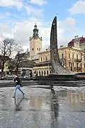 Taras Shevchenko monument on Freedom Avenue, with Latin Cathedral in the background