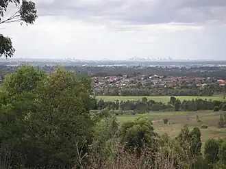 Suburb in foreground with residential houses