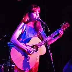 Lewis performing in 2013
