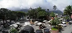 The main square — Parque Principal. Cerro de Cristo Rey in the background, covered by clouds