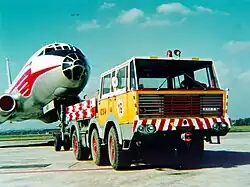 Airport tug T813 6×6 with Tu-104