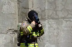 A firefighter in Toronto, Canada, wears a Nomex hood in 2007.