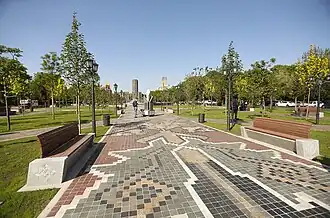 Paving designed with patterns from the “Guhar” dragon carpet