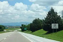 View from a divided highway in a rural area with two lanes per direction
