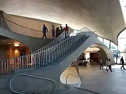 Curving staircase inside the headhouse, which doubles back on itself, leading to the upper level