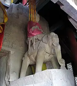 Statue of Puxian at Tianlongshan Grottoes in Shanxi, China. Flanking a central statue of Shiyimian Guanyin together with the bodhisattvas Wenshu.