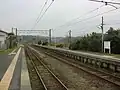 A view of the platforms and tracks. The siding can be seen in the distance branching left.