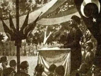 Engraving of Mustafa Reşid Pasha proclaiming the Tanzimat Edict in Gülhane Gardens, with banners and an audience of officials and soldiers