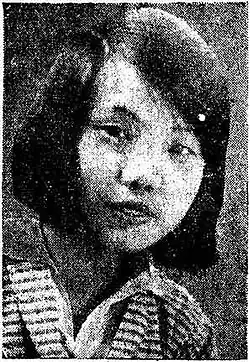A black and white portrait photo of a young woman facing right