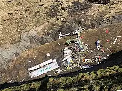 Destroyed wreckage of a propeller plane on a clifftop