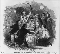 Angry men surrounding Smith at night