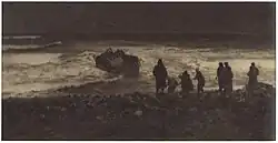 Dark photograph showing a group of people on the coast, looking out to a sinking boat