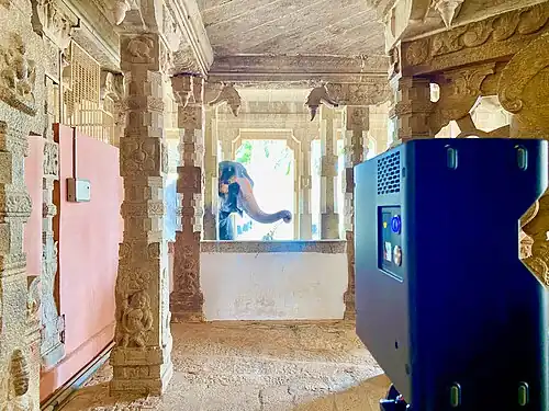 The scanner in the foreground, with the temple elephant visible in the background.