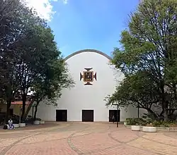 The church at the main entrance to the Medellín Campus on 70th Avenue