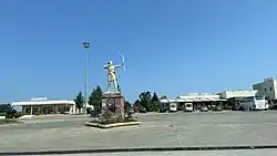 Bus station of Terme, with a statue of an Amazonian fighter in the foreground