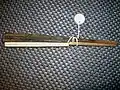 An iron Japanese tessen fan with wood ribs