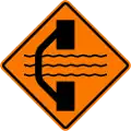 Bridge out ahead with a temporary bridge on a detour on left