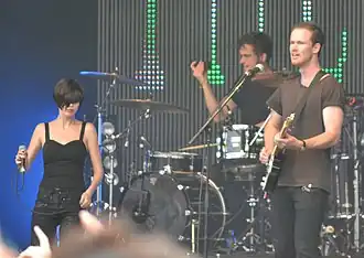 The Jezabels performing in 2012 L–R: Hayley Mary, Nik Kaloper, Sam Lockwood; Heather Shannon is out of shot.