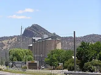 View across the rail lines and grain silos to The Rock Hill c.. 2005