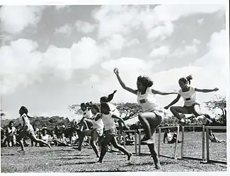Niue High School students running 100 metres hurdles, 1966
