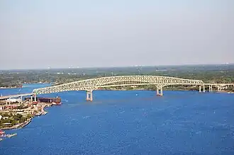 The Hart Bridge spanning the St. Johns River in Jacksonville, Florida, is a continuous, cantilevered truss bridge which combines a suspended road deck on the 332-metre (1,088&nbsp;ft) main span and through truss decks on the adjacent approach spans.