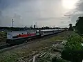 The SuPas (Surabaya-Pasuruan) commuter train in passenger coach-locomotive arrangement at Bangil prepared to depart for Pasuruan